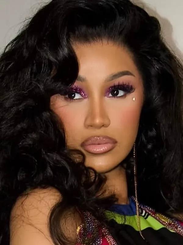 Cardi B with a voluminous dark cascade